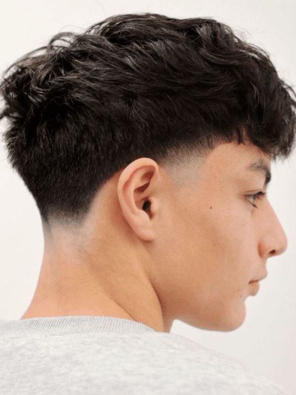 Low Taper Fade Fluffy Hair With Middle Part