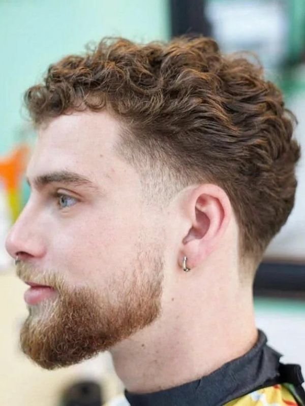 Low Taper Fade Middle Part Curly Hair