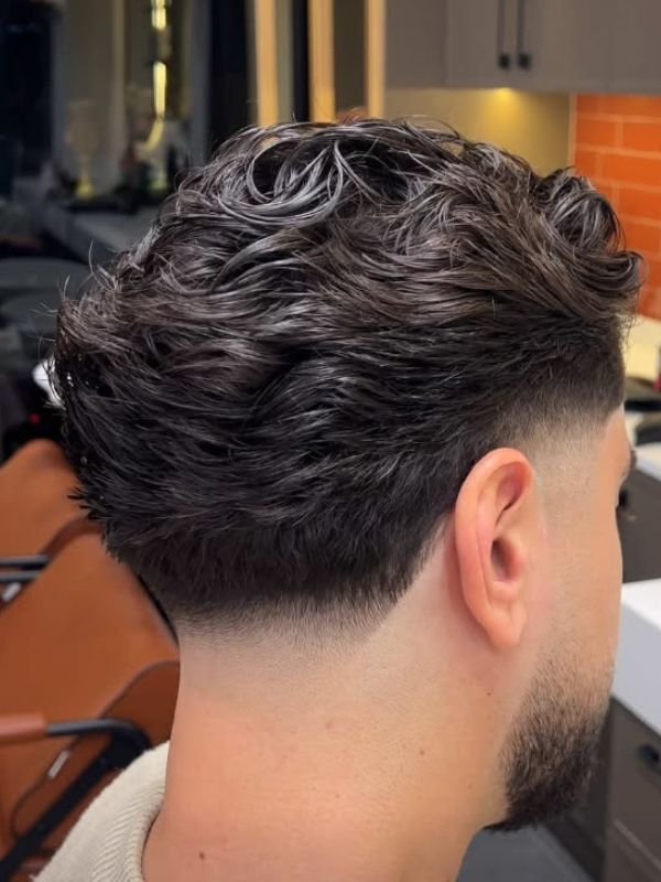 Low Taper Fade Middle Part Wavy Hair