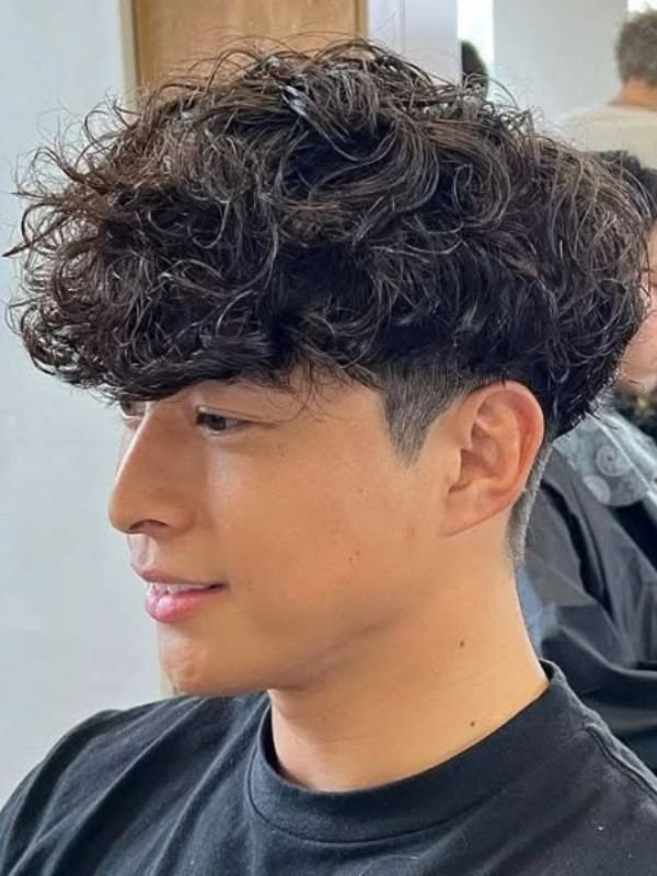 Low Taper Fade With Messy Fluffy Hair