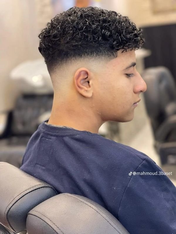 Low Taper Fade with Long Curly Top