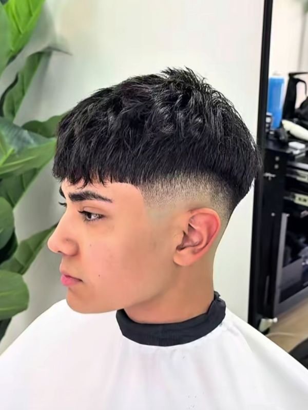 Low taper fade fluffy hair back