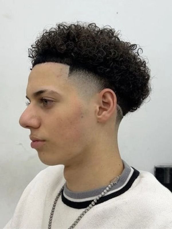 Low taper burst fade curly hair
